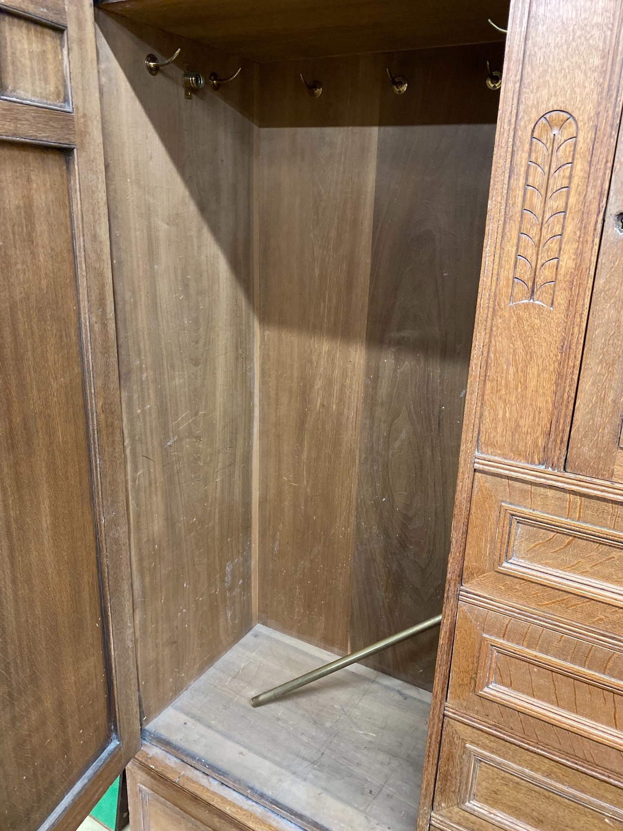 A late 19th century German Art Nouveau oak compactum wardrobe, length 224cm, depth 56cm, height 204cm